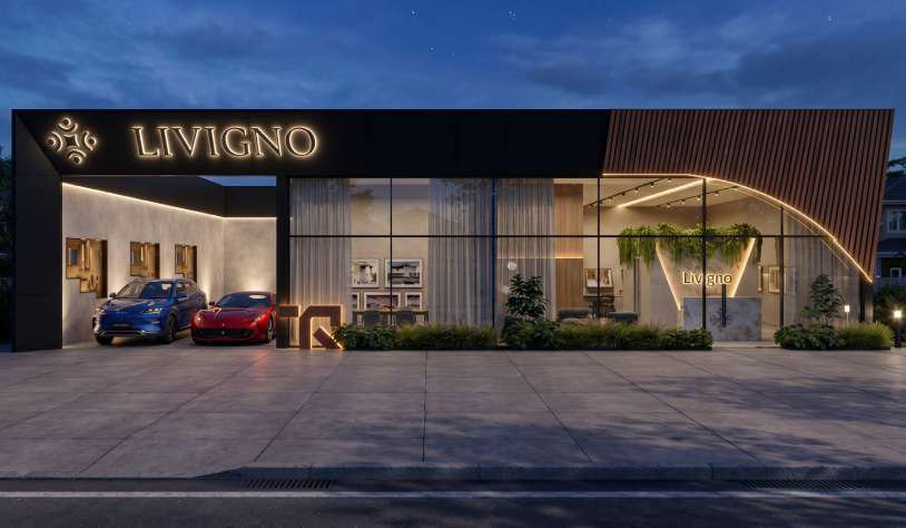 Stand Livigno à noite com letreiro iluminado e marquise curva de madeira