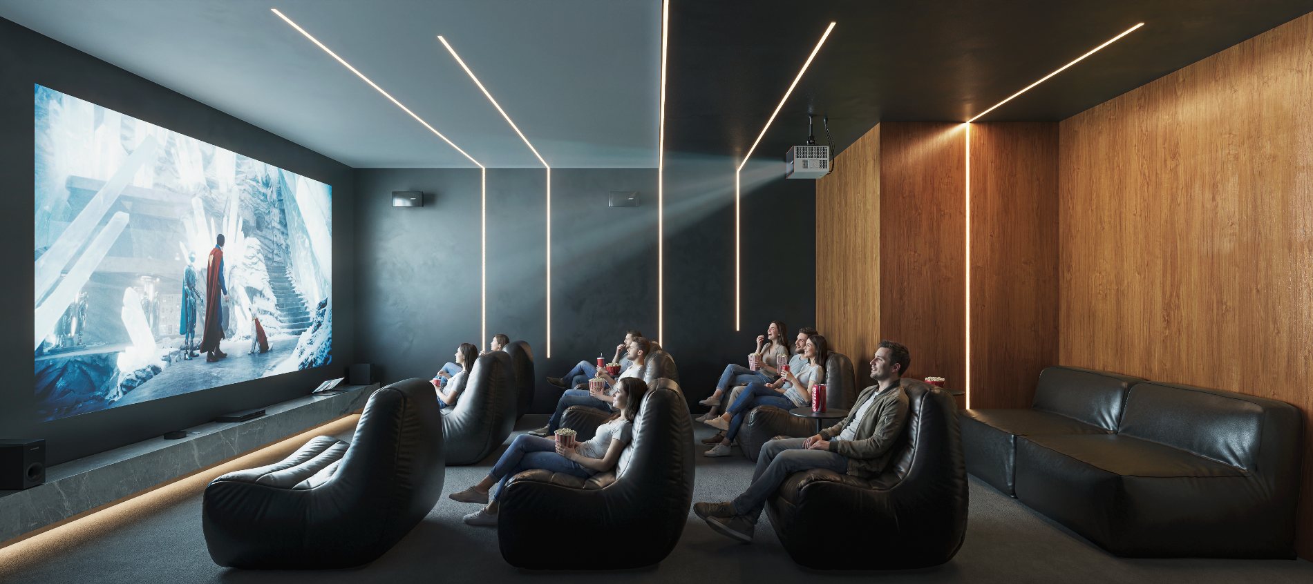 Cinema com poltronas pufe e iluminação linear no teto