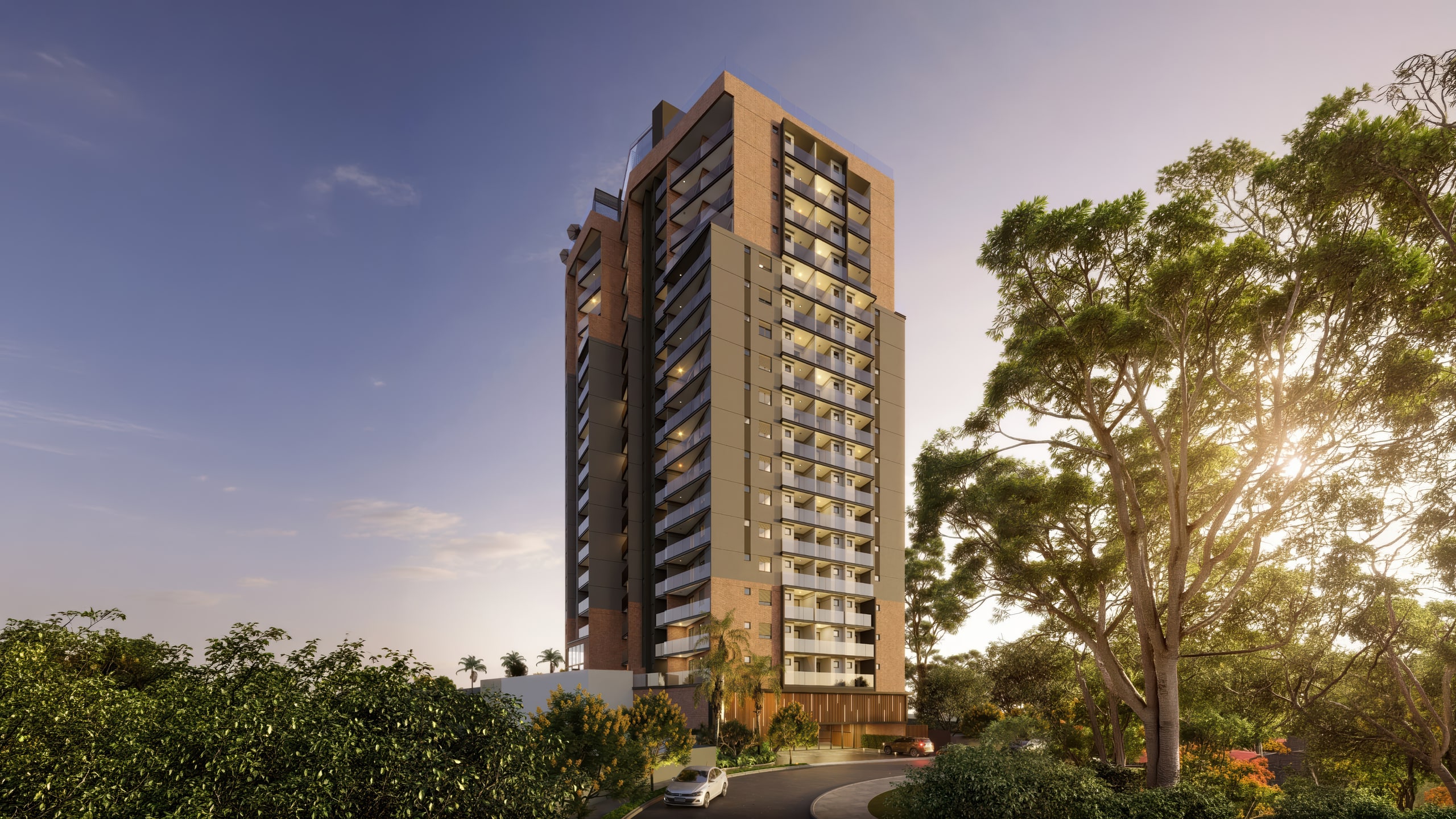 Torre residencial ao entardecer entre árvores, com varandas iluminadas